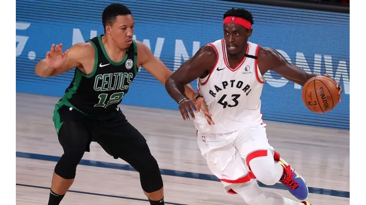 Pascal Siakam (right) of the Toronto Raptors drives the ball against Grant Williams (left) of the Boston Celtics. (Getty)