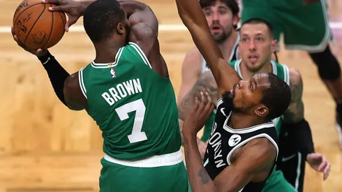 Jaylen Brown tries to score against Kevin Durant. (Getty)