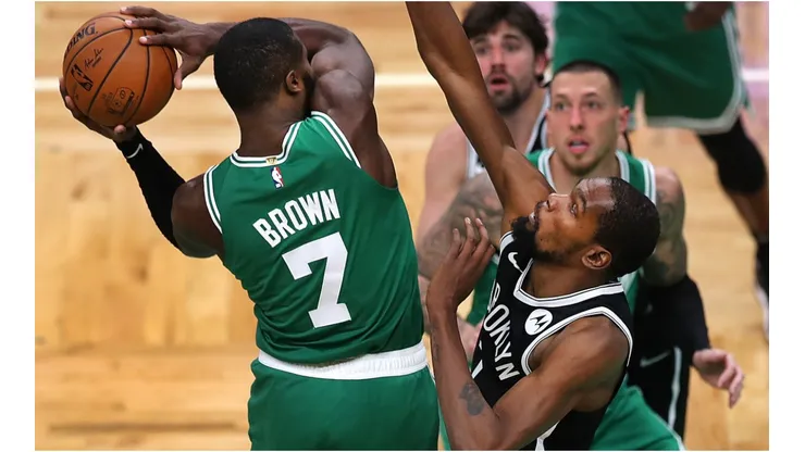 Jaylen Brown tries to score against Kevin Durant. (Getty)