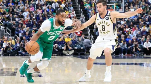 Brad Wanamaker (left) of the Boston Celtics dribbles the ball against the Indiana Pacers. (Getty)