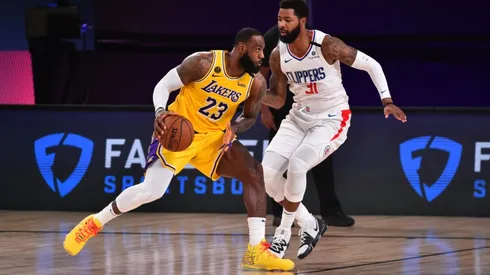 LeBron James (left) of the Los Angeles Lakers handles the ball against Marcus Morris Sr. (right) of the LA Clippers. (Getty)