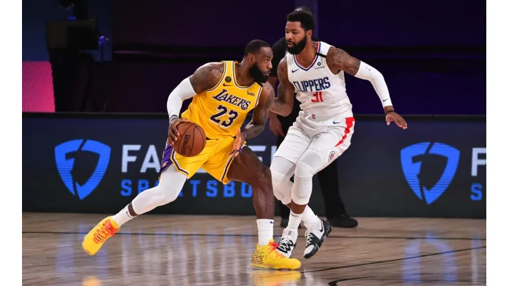LeBron James (left) of the Los Angeles Lakers handles the ball against Marcus Morris Sr. (right) of the LA Clippers. (Getty)