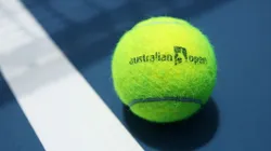 An Australian Open branded tennis ball is seen on court. (Getty)