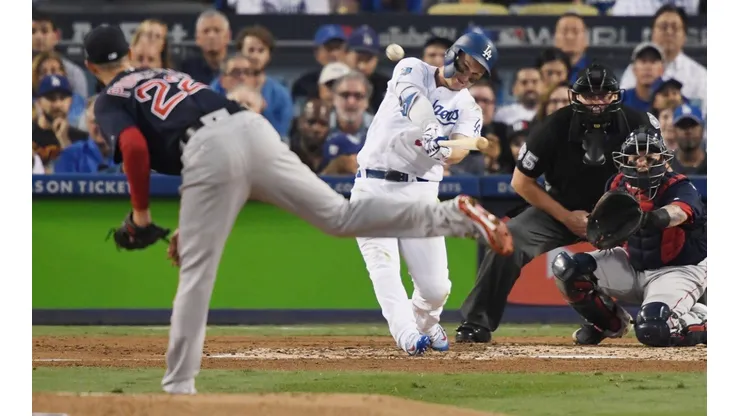 Joc Pederson (right) of the Los Angeles Dodgers hits a third inning home run on a pitch from Rick Porcello (left) of the Boston Red Sox. (Getty)