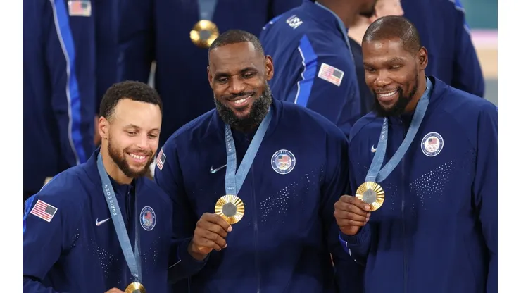 Stephen Curry, LeBron James, and Kevin Durant of Team United States pose for a photo during the Men's basketball medal ceremony on day fifteen of the Olympic Games Paris 2024 at Bercy Arena on August 10, 2024 in Paris, France.