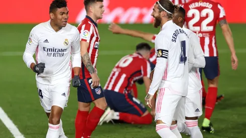 Casemiro (left) of Real Madrid celebrates with teammates after scoring against Atlético de Madrid (Getty).