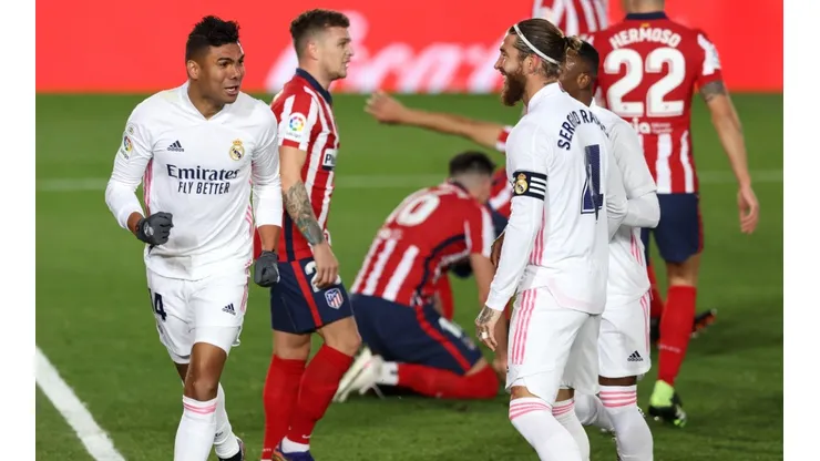 Casemiro (left) of Real Madrid celebrates with teammates after scoring against Atlético de Madrid (Getty).