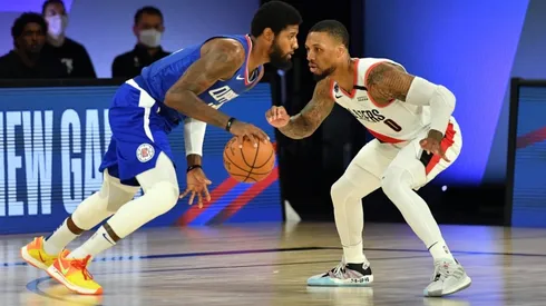 Damian Lillard guarding Paul George. (Getty)