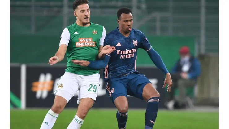 Gabriel of Arsenal (right) challenged by Ercan Kara of Rapid Wien (left). (Getty)