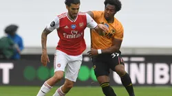 Dani Ceballos of Arsenal (left) is challenged by Adama Traore of Wolverhampton (right). (Getty).jpg