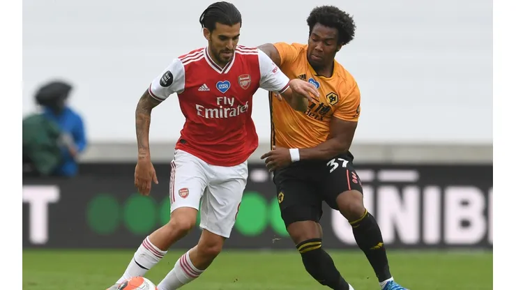 Dani Ceballos of Arsenal (left) is challenged by Adama Traore of Wolverhampton (right). (Getty).jpg