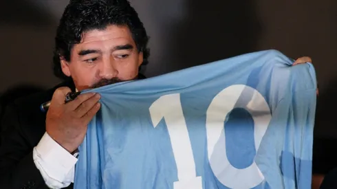 Diego Maradona kissing the Napoli soccer jersey (Getty).