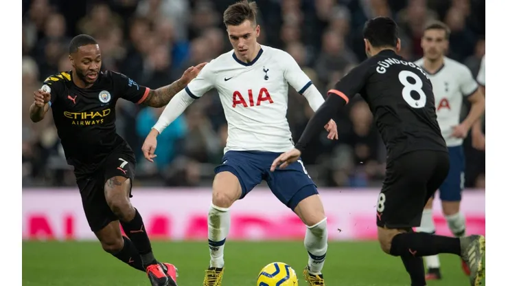 Giovani Lo Celso of Tottenham Hotspur (centre) and lkay Gundogan (right) and Raheem Sterling (left) of Manchester City. (Getty)