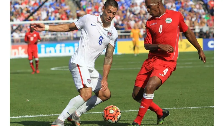 Clint Dempsey (left) fights for the ball during USA's 6-0 win over Cuba in 2015. (Getty)