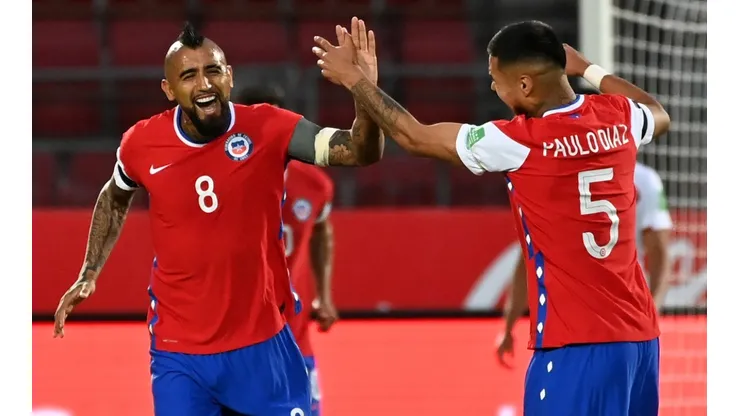 Arturo Vidal of Chile celebrates with teammate Paulo Díaz after scoring against Peru (Getty).