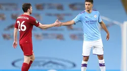 Andy Robertson of Liverpool (left) interacts with Rodrigo of Manchester City (right). (Getty)
