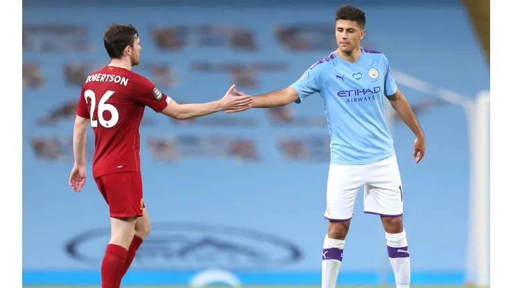 Andy Robertson of Liverpool (left) interacts with Rodrigo of Manchester City (right). (Getty)