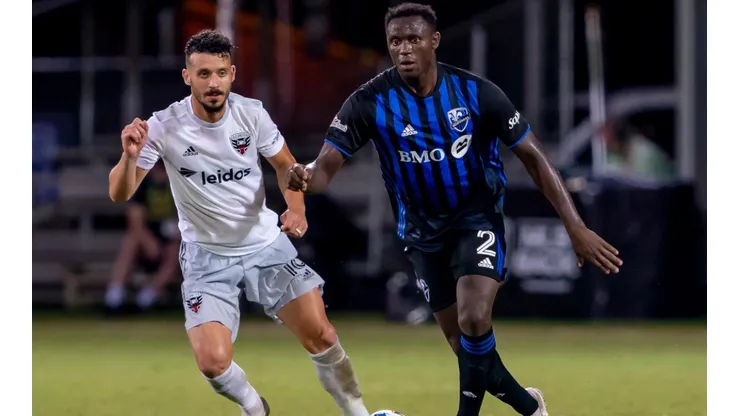 Montreal Impact midfielder Victor Wanyama (right) looks to pass the ball during the MLS Is Back Tournament between the Montreal Impact v DC United. (Getty)