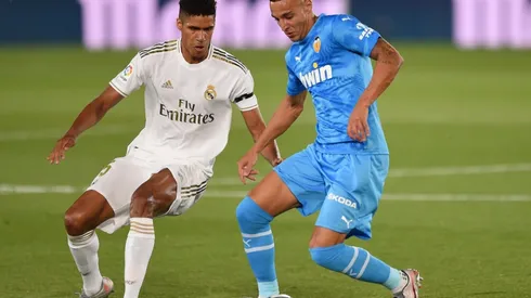 Rodrigo Moreno of Valencia CF (right) is challenged for the ball by Raphael Varane of Real Madrid (left). (Getty)