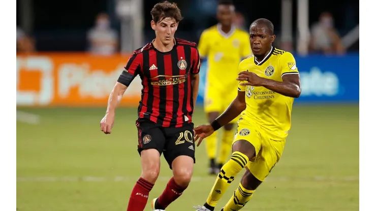 Emerson Hyndman of Atlanta United (left) runs with the ball against Darlington Nagbe of Columbus Crew (right). (Getty)