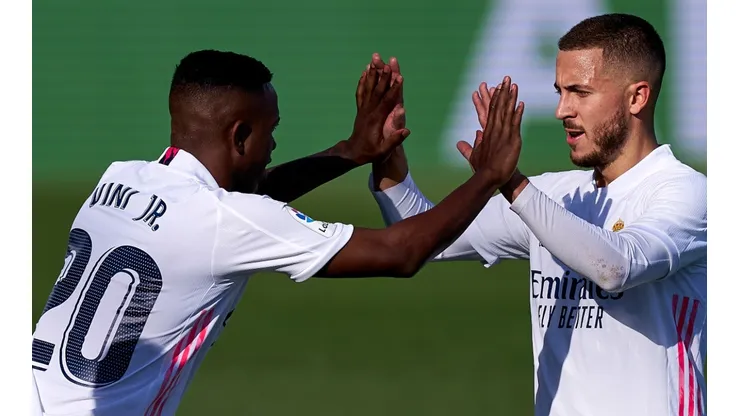 Real Madrid's Eden Hazard (right) celebrates with teammate Vinicius Jr. after scoring a goal (Getty).