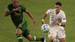 Julio Cascante of Portland Timbers (left) and Cristian Pavón of Los Angeles Galaxy compete for the ball (Getty).