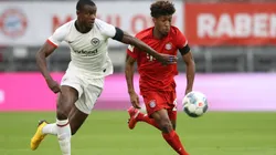Evan N'dicka of Eintracht Frankfurt (left) battles for possession with Kingsley Coman of Bayern Munich (right. (Getty)