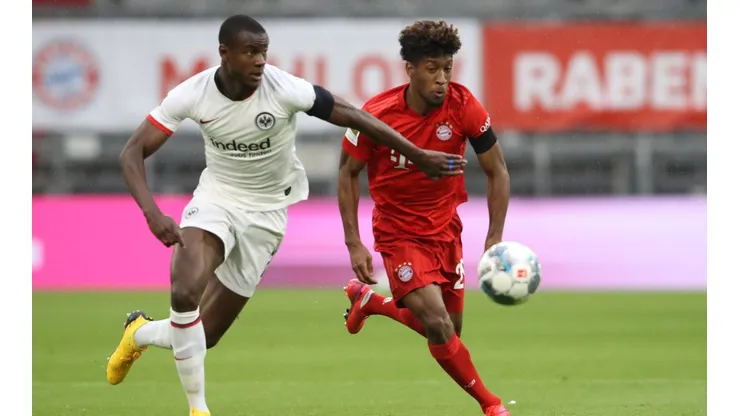 Evan N'dicka of Eintracht Frankfurt (left) battles for possession with Kingsley Coman of Bayern Munich (right. (Getty)