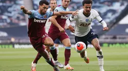 Dele Alli of Tottenham Hotspur (right) fights for the ball with Ryan Fredericks of West Ham (left). (Getty)