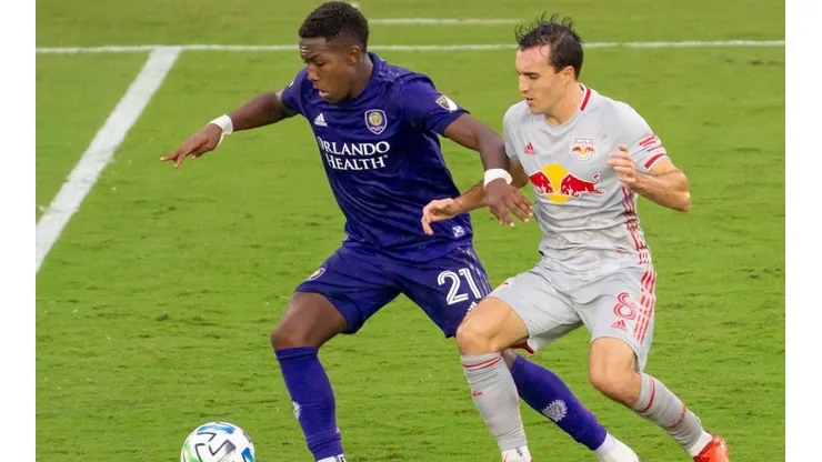 Orlando City midfielder Andres Perea (left) and New York Red Bulls midfielder Jared Stroud (right). (Getty)