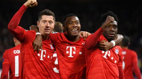 Robert Lewandowski of Bayern Munich celebrates with David Alaba and Alphonso Davies. (Getty)