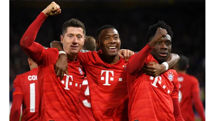Robert Lewandowski of Bayern Munich celebrates with David Alaba and Alphonso Davies. (Getty)