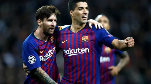Lionel Messi (left) and Luis Suarez (right) while playing for Barcelona. (Getty)