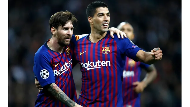 Lionel Messi (left) and Luis Suarez (right) while playing for Barcelona. (Getty)