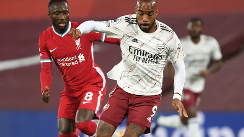 Alex Lacazette of Arsenal (right) and Naby Keita of Liverpool (left). (Getty)