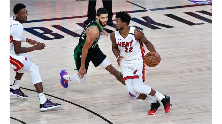 Jimmy Butler dribbles past Jayson Tatum. (Getty)