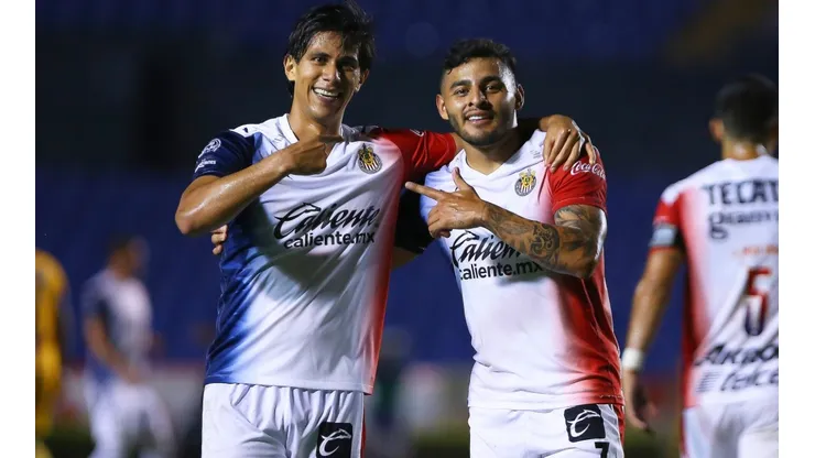 José Macías (left) of Chivas celebrates with teammate Alexis Vega after scoring a goal (Getty).