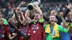 Jordan Henderson of Liverpool lifts the UEFA Super Cup trophy as Liverpool celebrate victory following the UEFA Super Cup match (Getty).