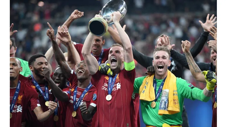 Jordan Henderson of Liverpool lifts the UEFA Super Cup trophy as Liverpool celebrate victory following the UEFA Super Cup match (Getty).