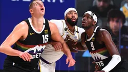 Nikola Jokic and Jerami Grant guarding Anthony Davis. (Getty)