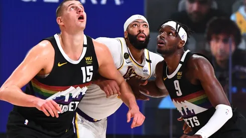 Nikola Jokic and Jerami Grant guarding Anthony Davis. (Getty)