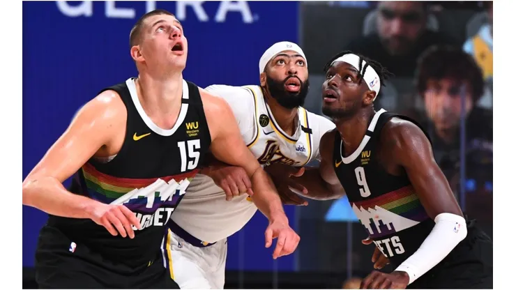Nikola Jokic and Jerami Grant guarding Anthony Davis. (Getty)