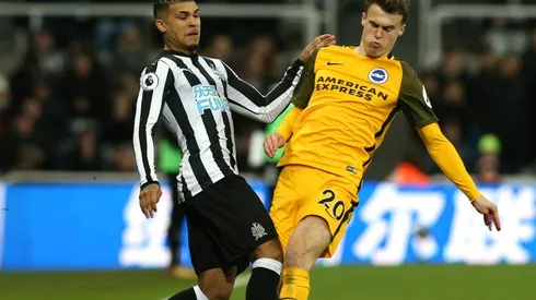 Deandre Yedlin of Newcastle (left) is challenging Solly March of Brighton (right). (Getty)