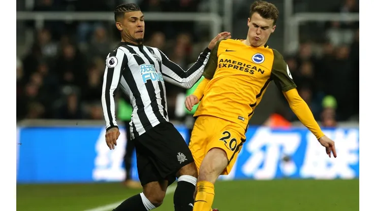 Deandre Yedlin of Newcastle (left) is challenging Solly March of Brighton (right). (Getty)