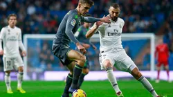Real Sociedad vs Real Madrid: Diego Llorente of Real Sociedad (left) competes for the ball with Karim Benzema of Real Madrid (Getty).