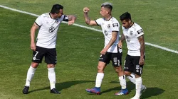 Colo Colo's Leonardo Valencia (center) celebrates with teammates (Getty).