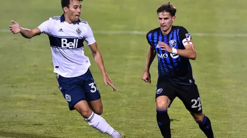Patrick Metcalfe of Vancouver Whitecaps (left) and Jukka Raitala of Montreal Impact (right). (Getty)