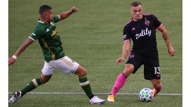 Seattle Sounders vs. Portland Timbers: Jordan Morris of the Sounders (right) protects the ball against Marvin Loria of Portland Timbers (Getty).