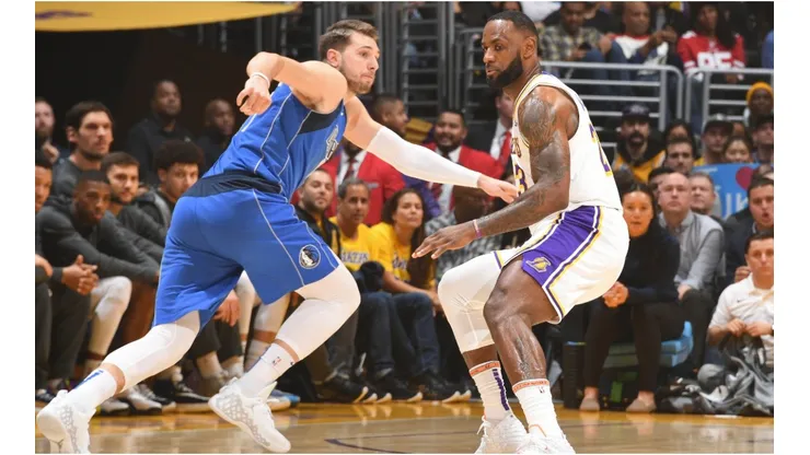 Luka Doncic trying to get past LeBron James. (Getty)