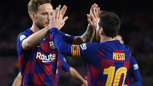 Barcelona's Ivan Rakitic (left) and Lionel Messi celebrate during a match (Getty).